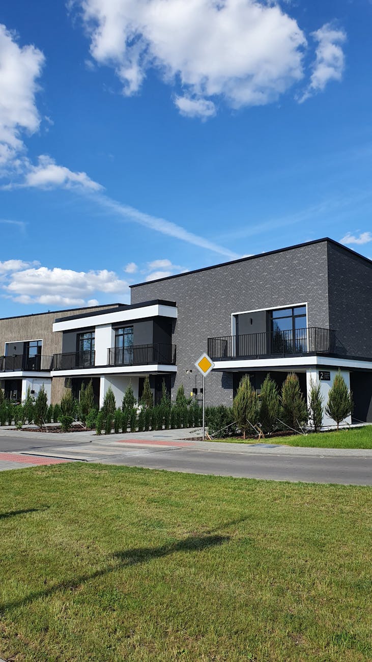 gray and white concrete house under blue sky